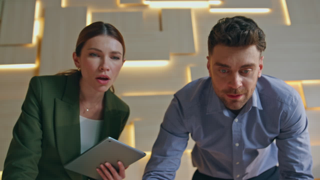 Team engineers analysing blueprint in creative architectural company close up.