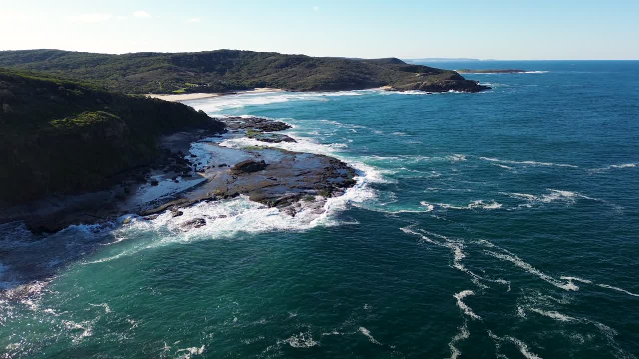 Aerial drone shot of Frazer Beach Newcastle National Park bushland Pacific Ocean Central Coast travel tourism Budgewoi NSW Australia 4K
