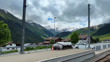 riding train passing on the mountain villages in switzerland. pov shot