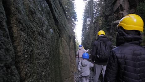 a group in hard hats journeys through a stunning canyon exploring a group in hard hats embarks on an adventurous journey through a stunning canyon showcasing teamwork and exploration in a beautiful landscape