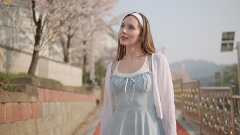 attractive caucasian lady walking at yangjae citizen's forest park in seocho district, seoul city, south korea