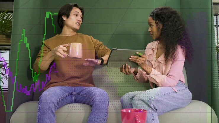 Vertical video: Pulling back camera showing pair reviewing tablet data at lounge with graph overlay