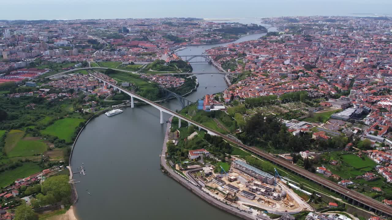 Aerial view of Porto, Portugal, showing bridges over the Douro River and the surrounding cityscape