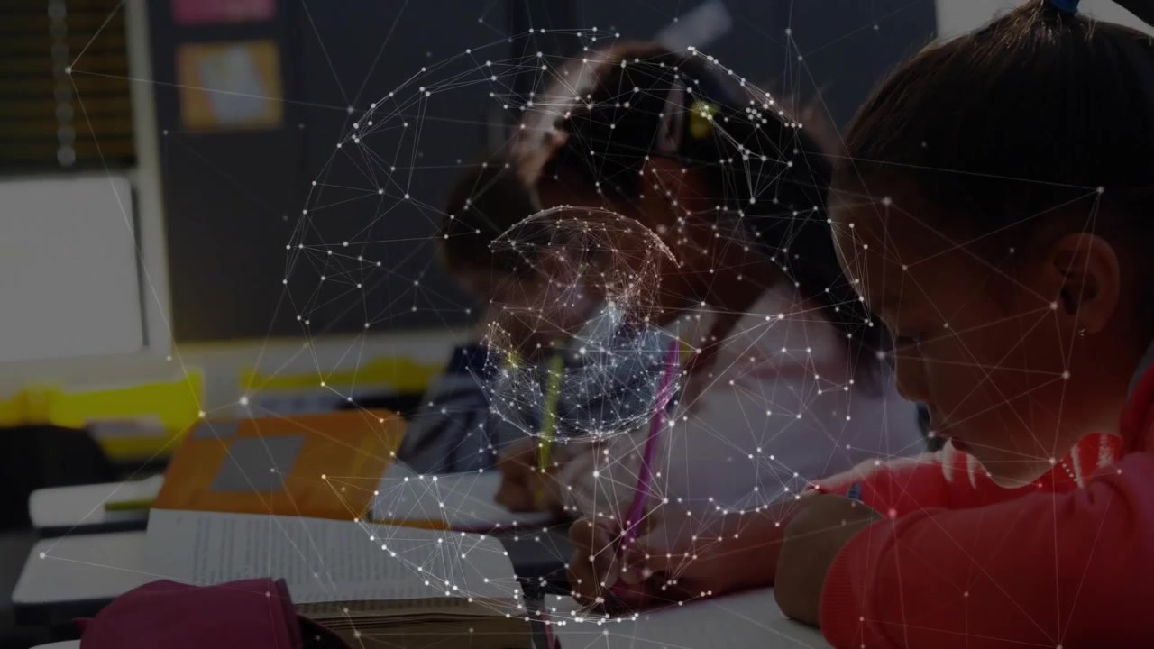 Three students writing in classroom, activating rotating network globe showing connected learning