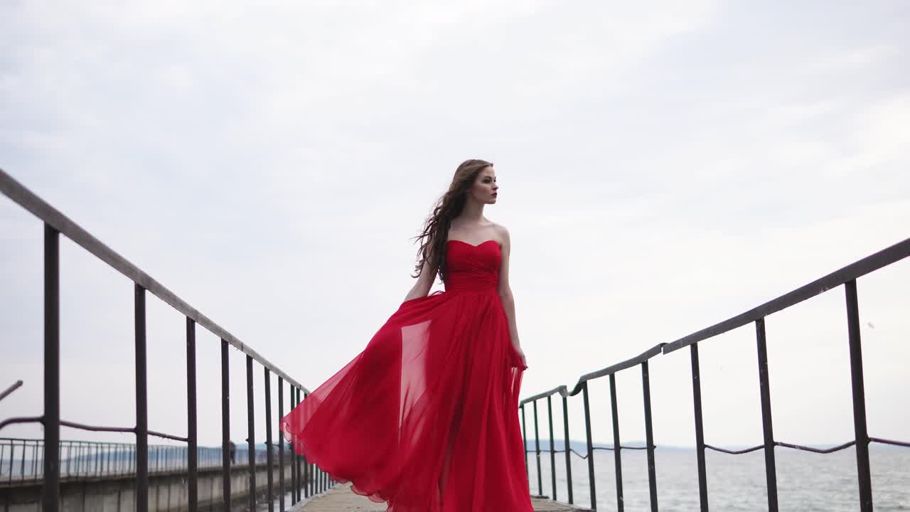 Woman in Red Dress on a Pier