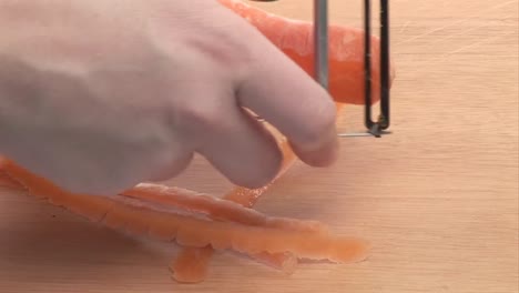 stock footage of a carrot being peeled