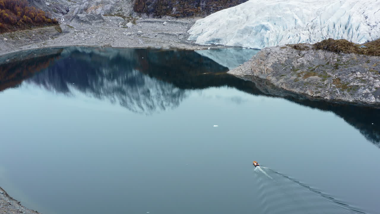 Boat Across Tranquil Waters Of Beagle Channel In Tierra del Fuego Archipelago, Argentina. Aerial Drone Shot