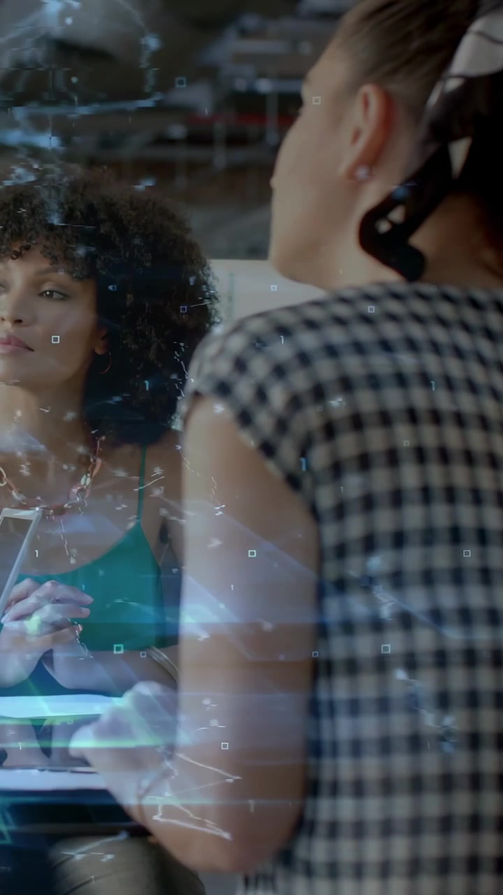 Vertical video: Right listener absorbing tech as speaker tapping phone, holo sweeping across glass