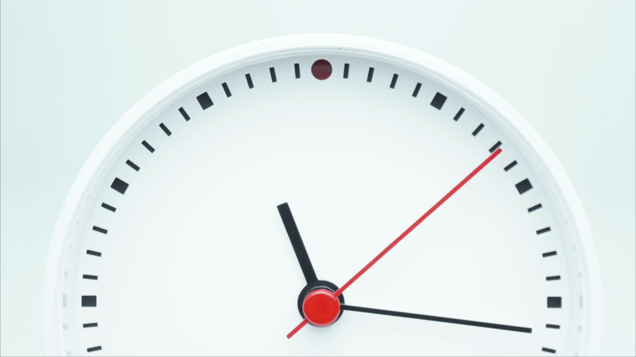 Time lapse white  clock tells the time 11 o'clock and 30 minute.