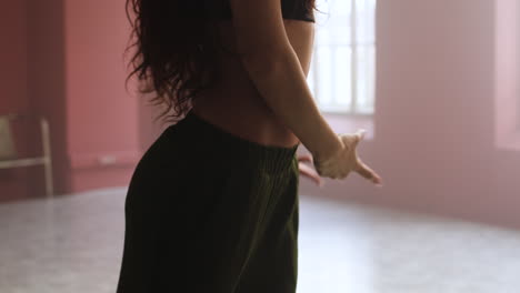 young woman dancing in a classroom