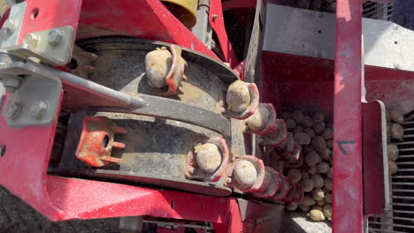 conveyor belt on a tractor trailer planting potatoes in a farming ground