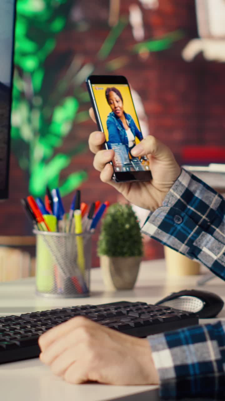 Vertical video Man at home watching social media live broadcasts, interacting in chat