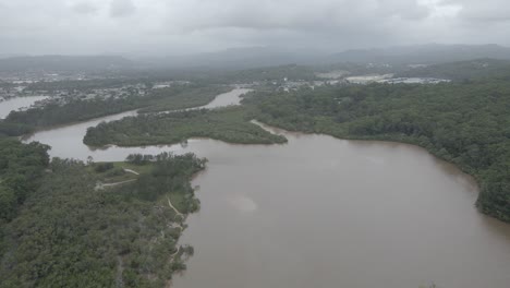 Aerial-View-Of-Tallebudgera-Creek-Waterway-And-Dense-Forest-On-A-Cloudy-Day-In-South-East-Queensland,-Australia