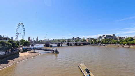 a boat travels along the river thames