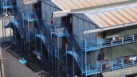 workers moving on stairs of industrial building