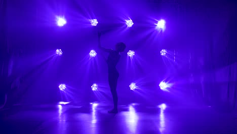 silhouette dancer in blue light