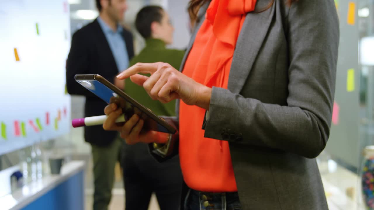 Woman tapping and swiping tablet launching holographic panels rising for business brainstorming
