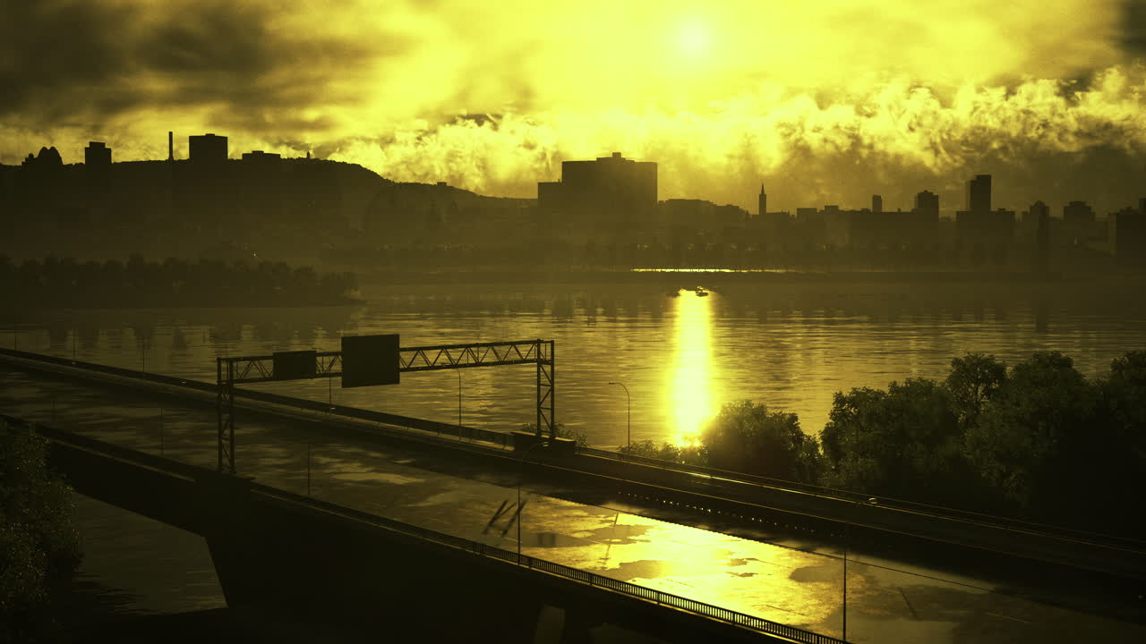 Golden sunset reflection over river with city skyline and highway