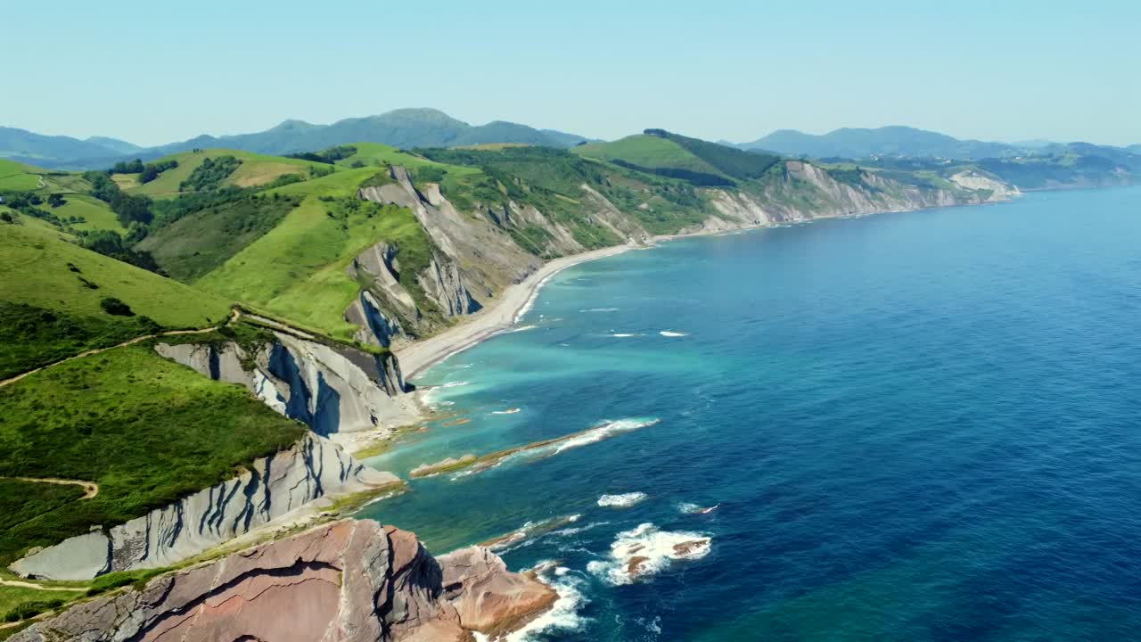Scenic Coastal Landscape with Cliffs and Green Hills