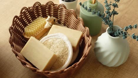 Still life with soap, loofah, brush, lavender, and vase