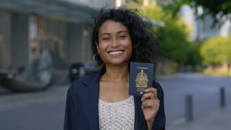woman holding a canadian passport