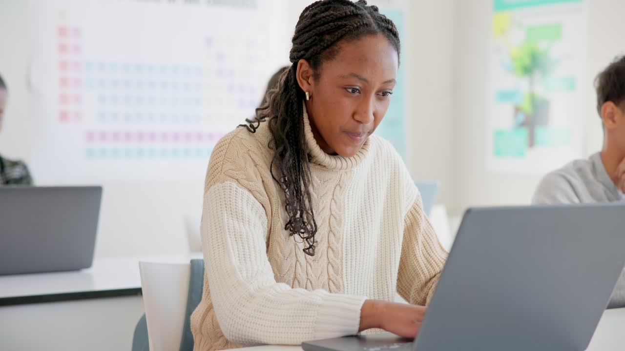 Girl, students and laptop in a classroom