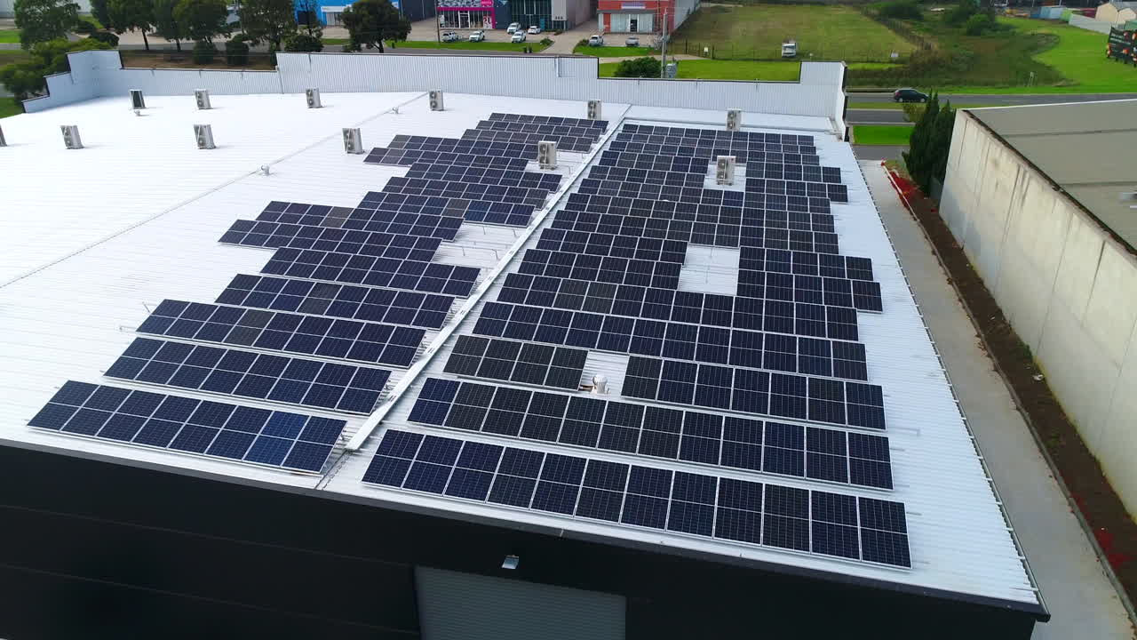 Aerial shot of solar panels on roof of building
