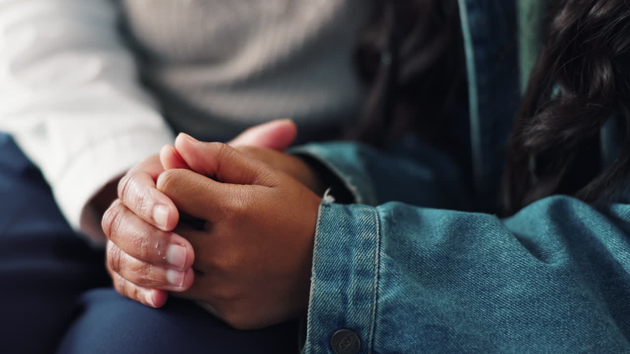 Supportive hands in denim jacket
