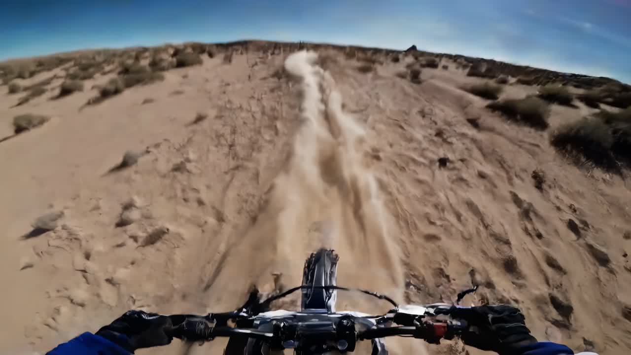 Exciting video of a dirt bike racing through a desert landscape, capturing the thrill and speed