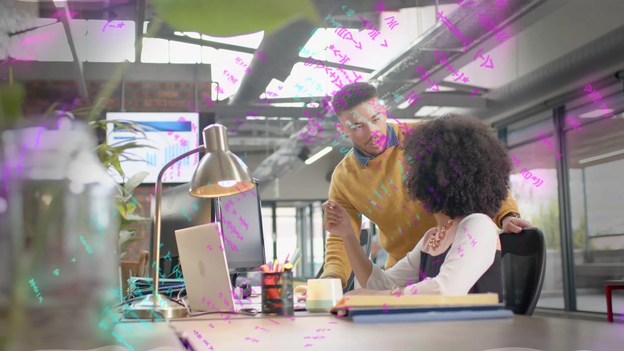 Woman tapping laptop, man leaning pointing at chart, scribbles overlaying, analyzing business data