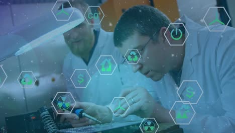 Animation of icons and snow falling over diverse male scientists in lab