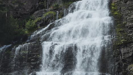 a powerful torrent of whitewater cascades from the mountain
