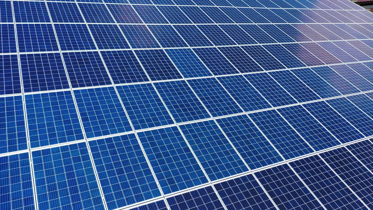 Aerial view. Top view on blue solar pannels. Green energy. Pannels on the roof.