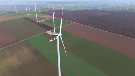 Aerial-Drone-View-Of-Wind-Power-Station-In-Countryside-Fields