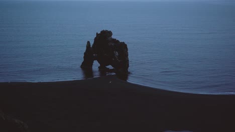 different shots, including slowmo, roll, dolly in all types of light showing hvitserkur rock in iceland