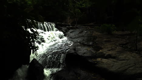 Looking-at-the-waterfall-in-Thailand.