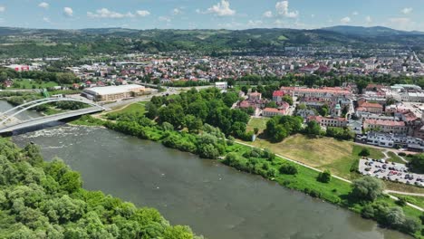 contemporary city residential area and modern bridge on river in poland, aerial