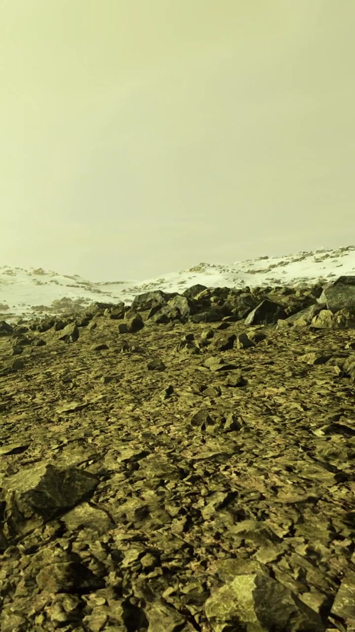 Winter landscape with rocks and snow under cloudy sky in a remote area