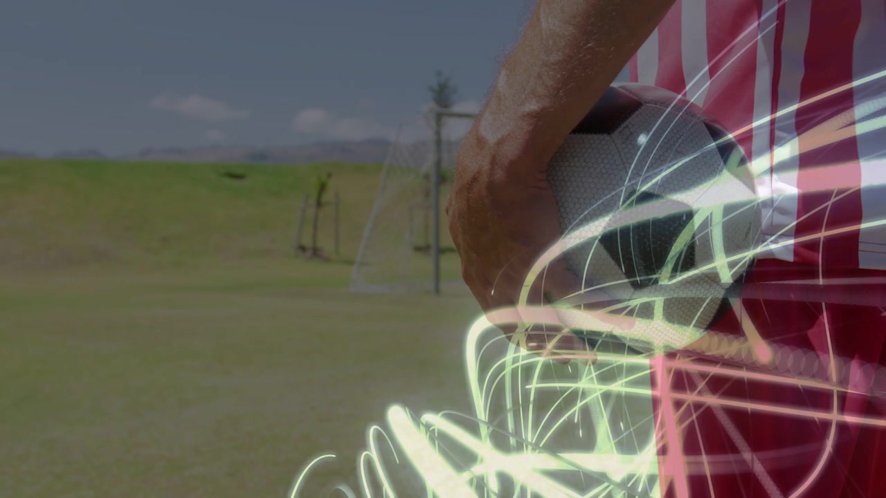 Male soccer player holding ball, neon streaks appearing, layering over ball, highlighting sports ad