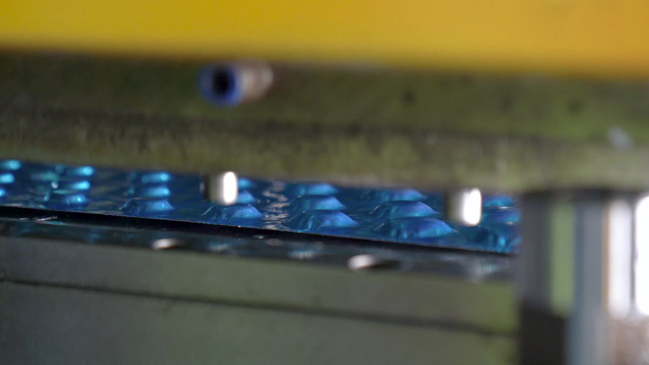 Automated CNC Punching Machine During Production Process In A Metalworking Factory, Close Up Shot.