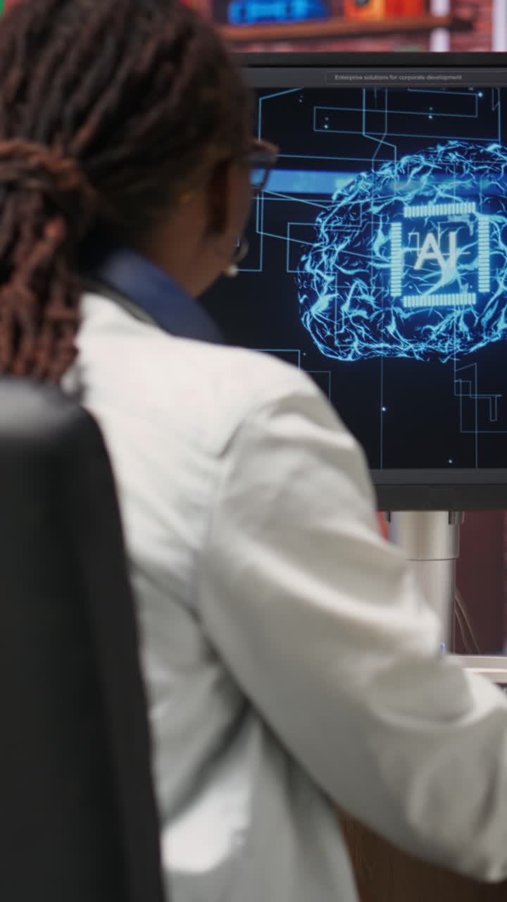 Vertical video Computer engineer doing checkup on artificial ...