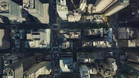 Aerial-birds-eye-overhead-top-down-panning-view-of-high-rise-apartment-or-office-buildings-in-midtown.-Manhattan,-New-York-City,-USA