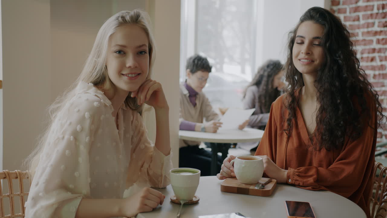 Friends enjoying coffee at a cafe