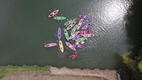 aerial view of colorful kayaks on a lake