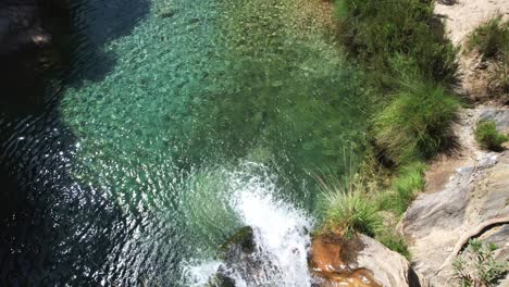 Waterfall-and-stream-with-colorful-green-waters