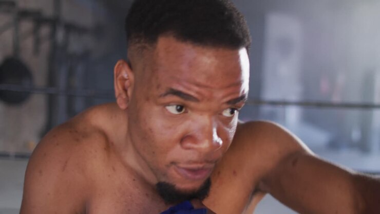 Video of fit african american man boxing at gym