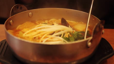 hot pot with noodles and seafood