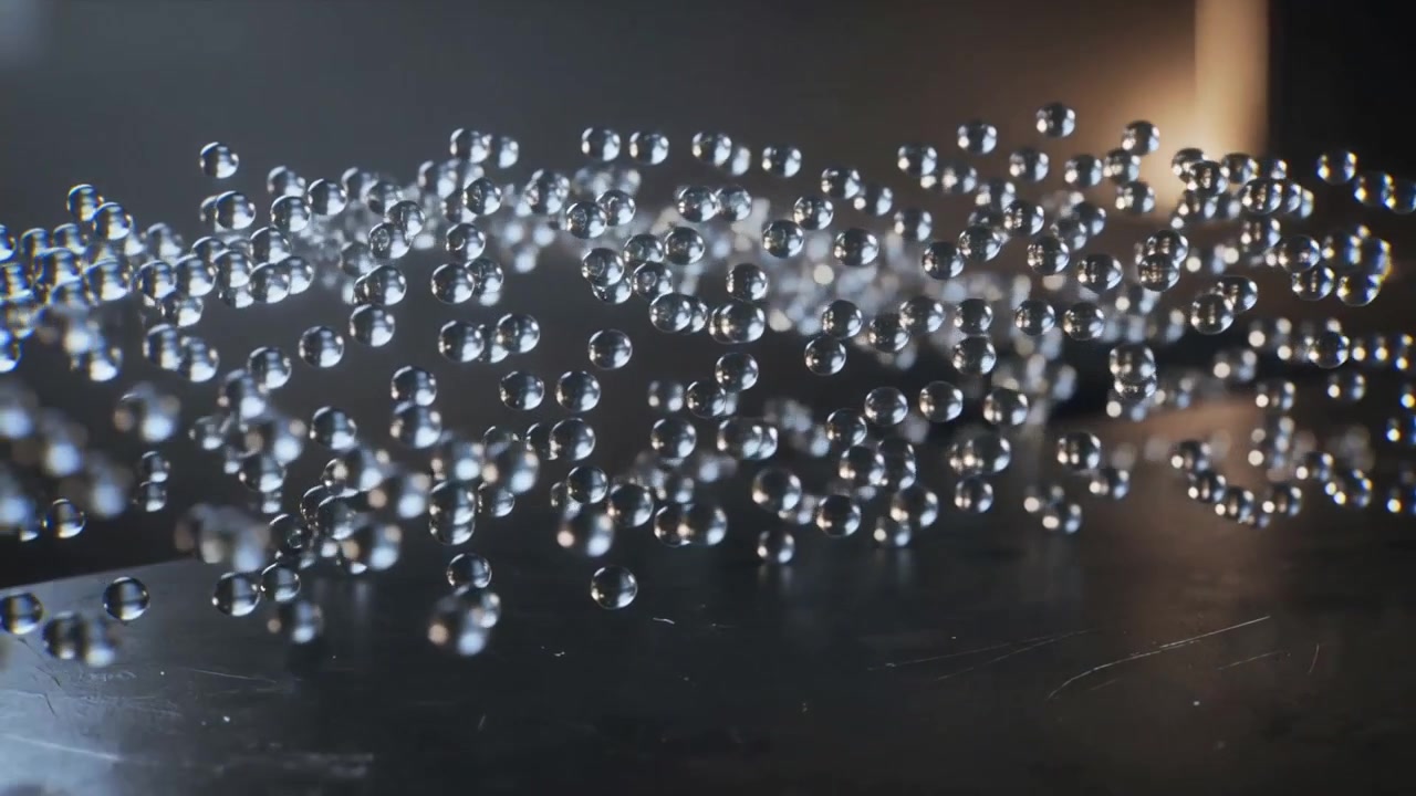 Camera shifting droplets pooling and focusing over scratched metal in studio, window adding glow