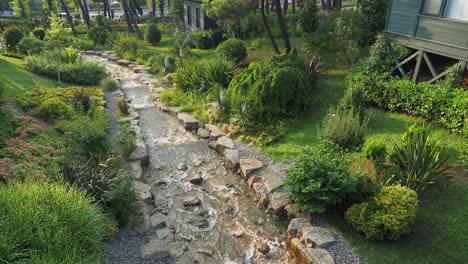 tranquil stream flowing through lush garden