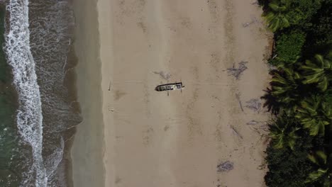 Rocket-shot-of-an-old-fisherboat-on-El-Valle-beach-on-the-Samaná-peninsula-in-the-Dominican-Republic